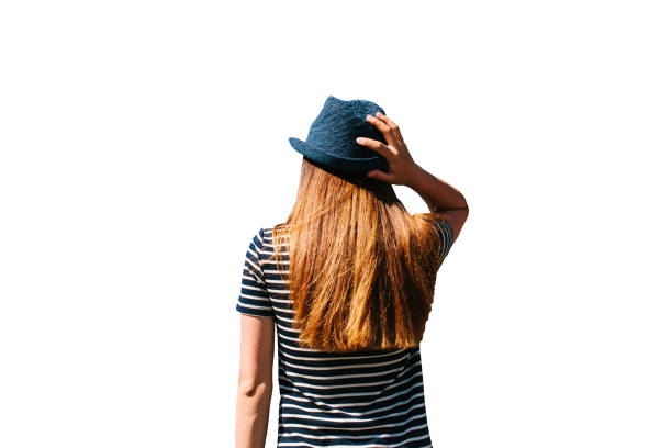 Brunette or red-haired girl in a hat rear view isolated on a cute background.