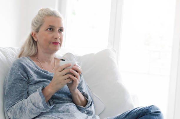istock Woman holding cup of coffee 1027241546