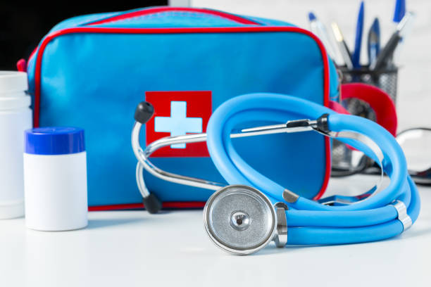 istock Stethoscope, laptop and pills on the white table 1027241898