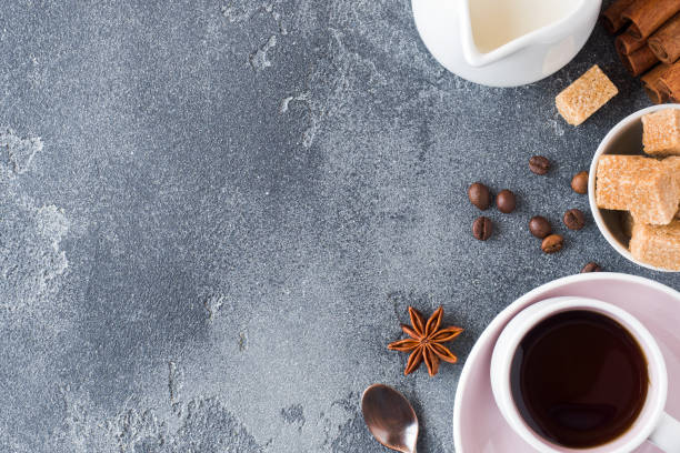 istock Cup of coffee, brown sugar and cinnamon with anise on concrete background. Copy space 1027242216