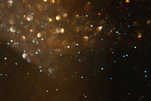 istock glitter vintage lights background. black, silver and gold. de-focused 1027242320