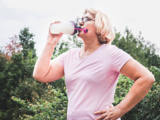 istock Cute, adult woman in a break between exercises 1027253730