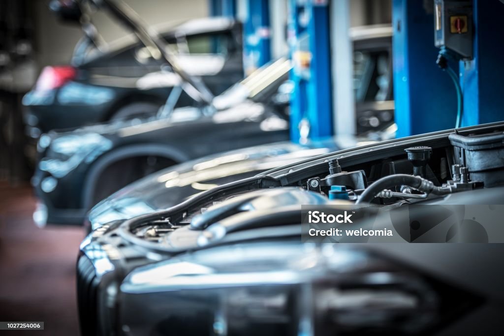 Car in Auto Service Broken Cars in Auto Service. Vehicle Engine Problem. Open Hood. Auto Repair Shop Stock Photo