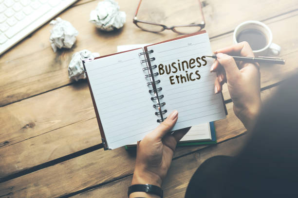 istock woman written business ethics text on notepad on office desk 1027257892