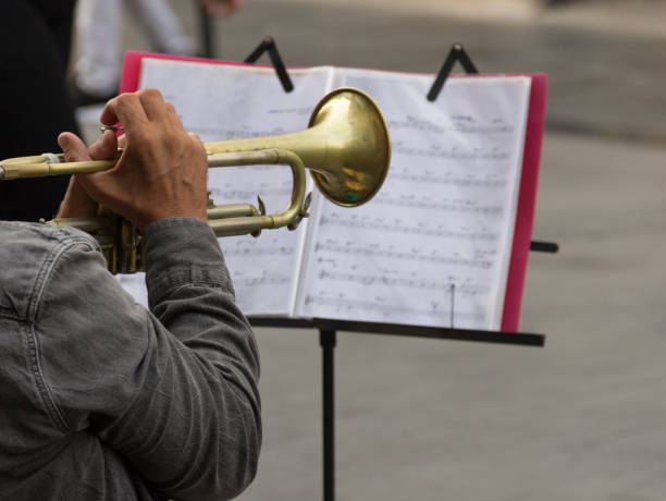 istock Street trumpet player with score 1027257938