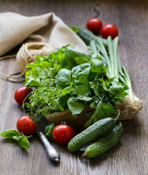 Fresh vegetables for salad vegetables and greens for salad on a wooden table 11154 stock pictures, royalty-free photos & images