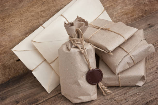 istock pile parcel wrapped with brown kraft paper 1027262592