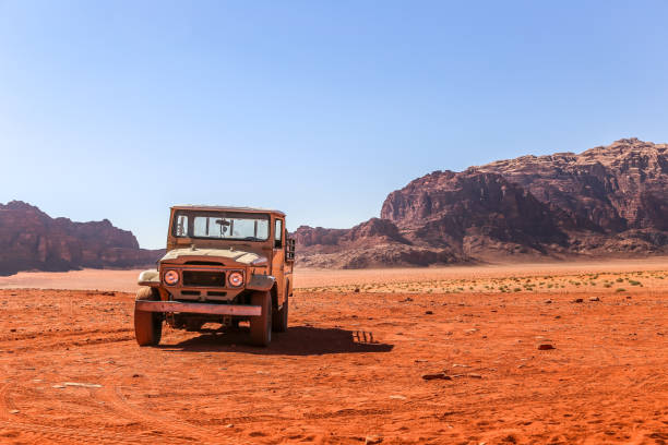 istock Old car in the Wadi Rum Desert, Jordan 1027265398