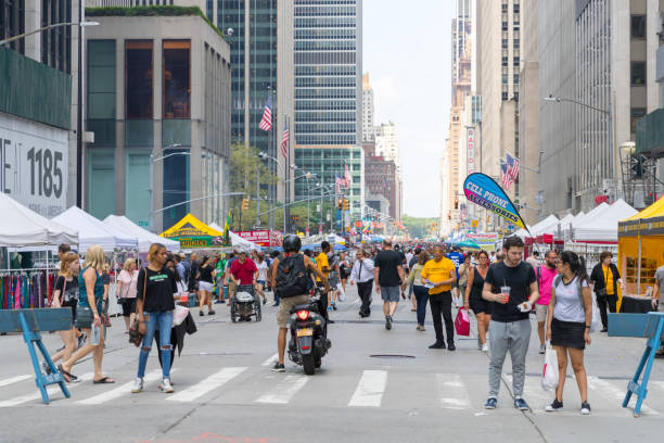 People visiting a street market in New York City stock photo