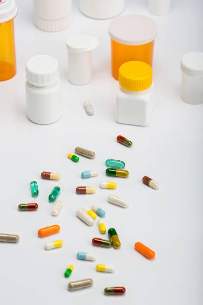 istock Medicine pills in small plastic bottles 1027266646
