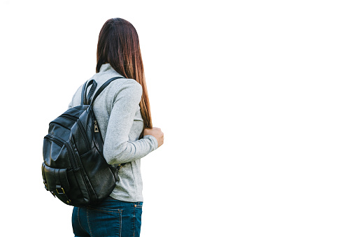 Girl or teenager with backpack isolated on white background.