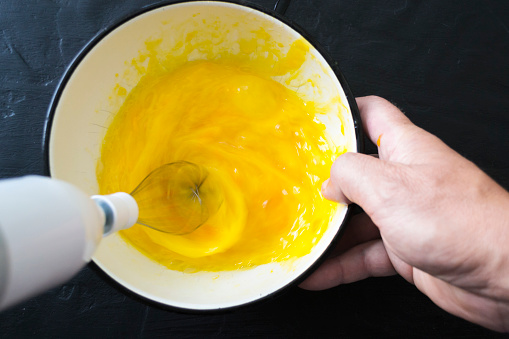 Preparation of homemade cakes. Whipping eggs.