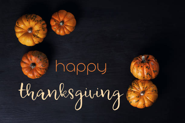 istock Happy Thanksgiving greeting card with orange pumpkins 1027272718