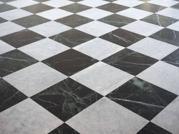 istock chequered white green and black stone floor background 1027272758