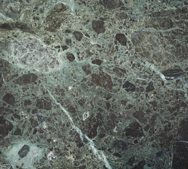istock glossy green and black marble texture background 1027273588