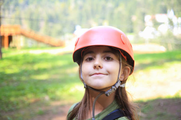 istock Girl with protection helmet outdoor 1027283906