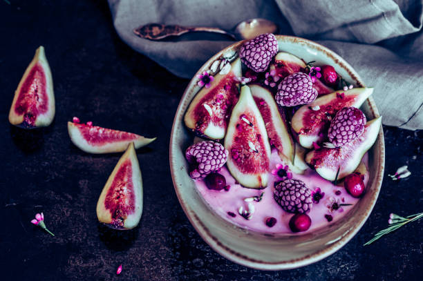 istock Healthy breakfast bowl with yogurt, fresh figs and frozen berries 1027289356