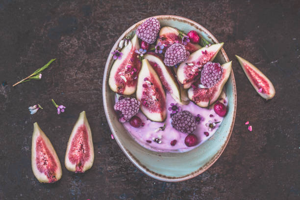 istock Healthy breakfast bowl with yogurt, fresh figs and frozen berries 1027289496