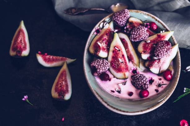 istock Healthy breakfast bowl with yogurt, fresh figs and frozen berries 1027289536