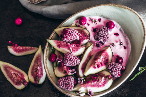 istock Healthy breakfast bowl with yogurt, fresh figs and frozen berries 1027289652