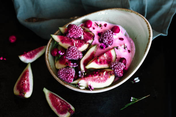 istock Healthy breakfast bowl with yogurt, fresh figs and frozen berries 1027289840