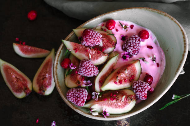 istock Healthy breakfast bowl with yogurt, fresh figs and frozen berries 1027289968