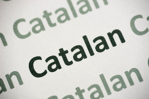 word Catalan  language printed on white paper macro