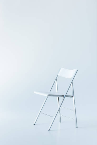 istock one white chair, isolated on white with copy space 1027307758