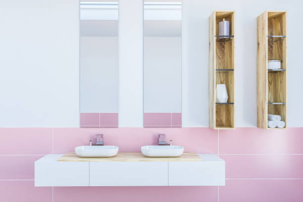 istock Double bathroom sink in white and pink room 1027310152