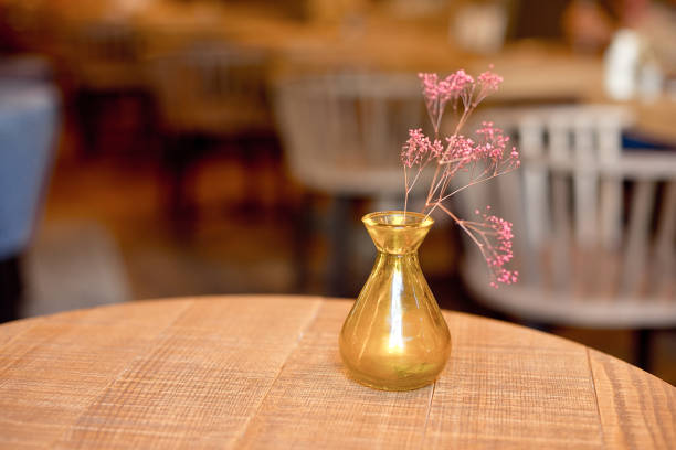 istock Small rustic vase with flowers on the table 1027310726