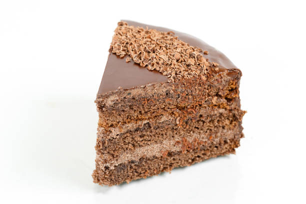 istock chocolate cake, cocoa biscuit with walnut filling and dark chocolate icing served on a plate. 1027317812