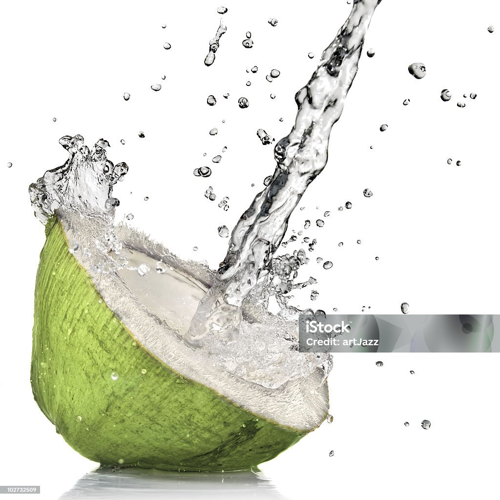 fresh cut green coconut with water splash on white green coconut with water splash on white Coconut Water Stock Photo