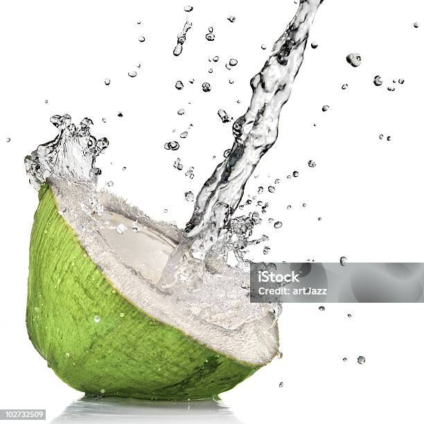 Fresh Cut Green Coconut With Water Splash On White Stock Photo - Download Image Now - Coconut Water, Coconut, Green Color