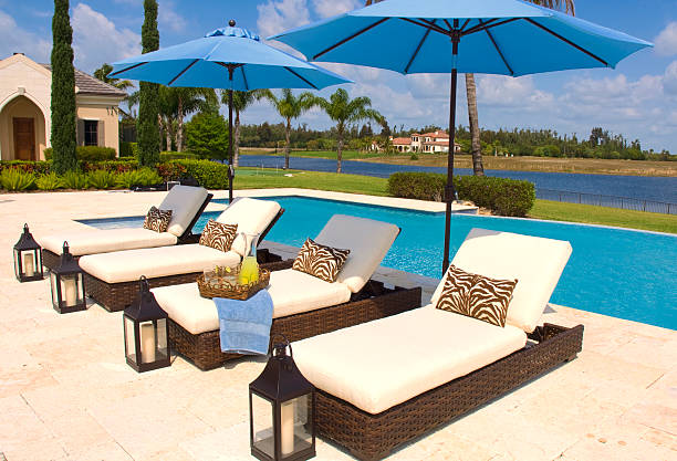 istock Tropical Poolside Recliners And Umbrellas 102732887