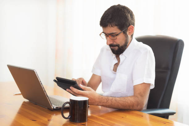 istock Portrait of a handsome hipster guy working at the office 1027329044