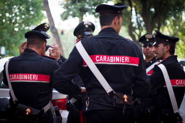Rome, Italy: Carabinieri Officers Chatting Rome, Italy: Carabinieri officers in full uniform chatting in central Rome. The carabinieri police both the military and civilians in Italy. lazio photos stock pictures, royalty-free photos & images