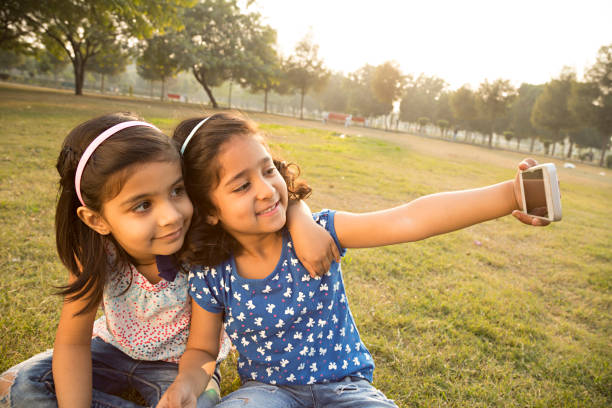 istock Little girl taking a selfie - Stock image 1027332220