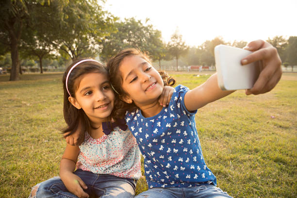 istock Little girl taking a selfie - Stock image 1027332506