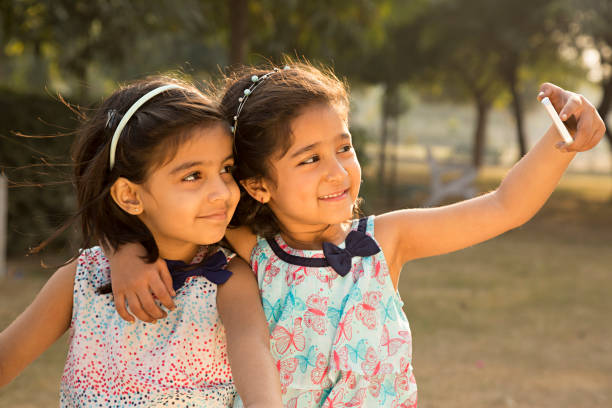 istock Little girl taking a selfie - Stock image 1027332574
