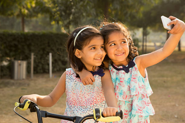 istock Girl Riding a Bike - Stock image 1027332782
