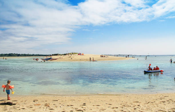 Brittany, Finistere, France - August, 19, 2018: Little boy at Letty Beach and La Mer Blanche « White sea » - preserved natural lagoon between Benodet et Mousterlin, Brittany, Finistere, France