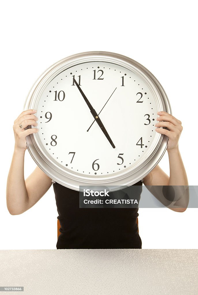 Woman at work holding large clock  Adult Stock Photo