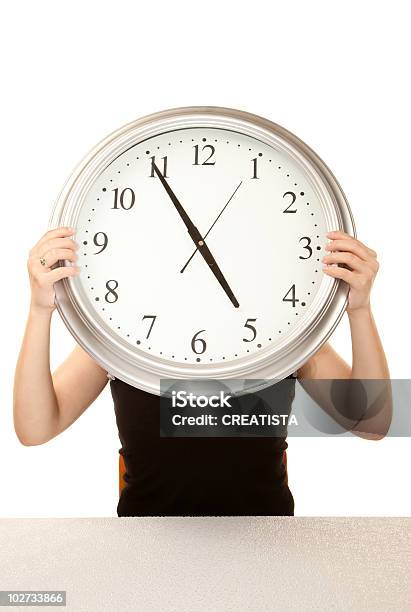 Woman At Work Holding Large Clock Stock Photo - Download Image Now - Adult, Business, Clock