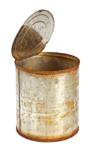 Sugar jar with spoon on plain background