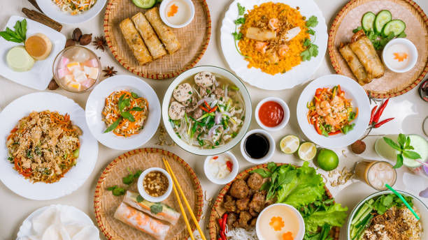 istock Assorted asian dinner, vietnamese food. Pho ga, pho bo, noodles, spring rolls 1027341982