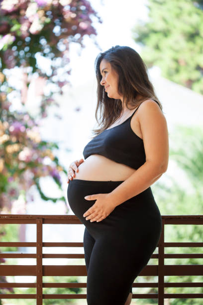 istock pregnant, happy mother, while waiting for her baby 1027350288