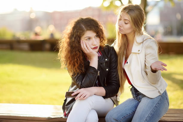istock Young woman support and soothe her upsed friend 1027350696
