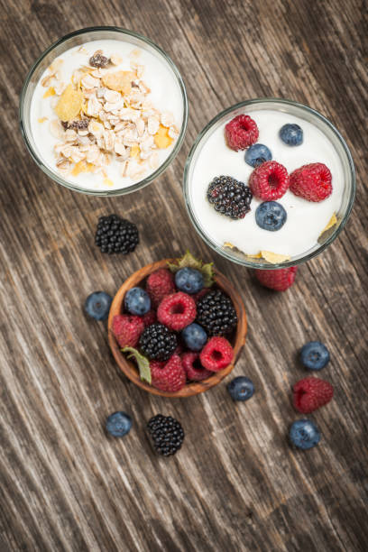 istock Healthy breakfast with Fresh greek yogurt, flakes and berries 1027356350