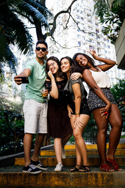 istock Young friends taking a selfie on a building backyard 1027361668