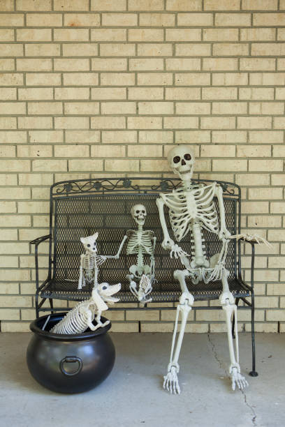 istock Group of Halloween skeletons on a porch 1027370106